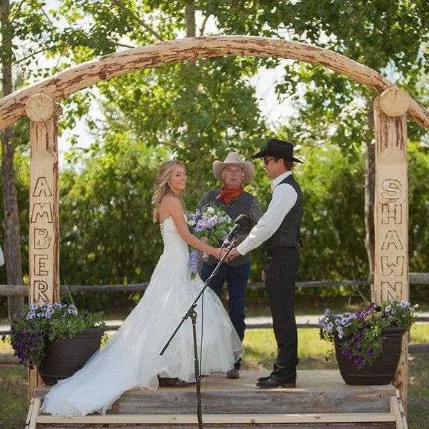 Amber Marshall and Shawn Turner at their hand-carved wooden wedding altar on her Alberta farm in 2013