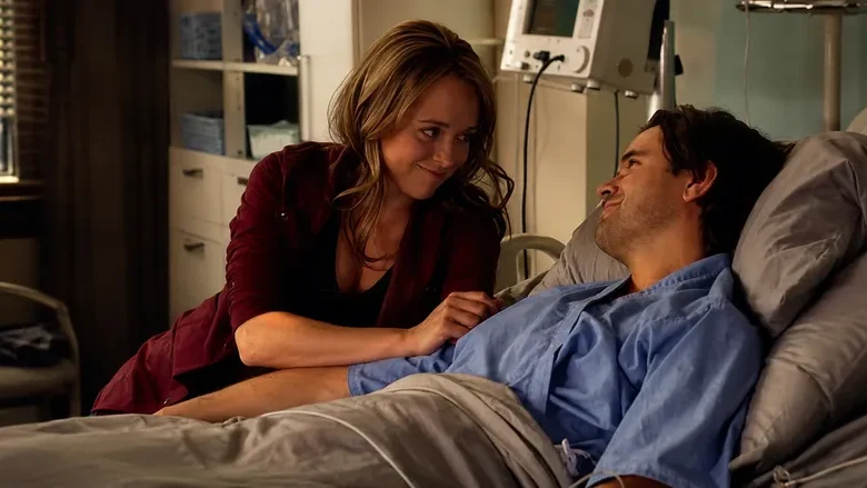 Amy Fleming sits beside Ty Borden in a Heartland hospital scene