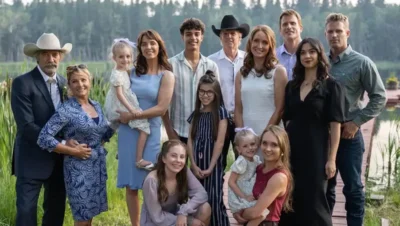 Cast of Heartland Season 18 standing together near a lake with title text overlay reading ‘Heartland: Season 18 – Still Riding Strong