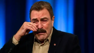 Tom Selleck wiping away tears in a rare emotional moment