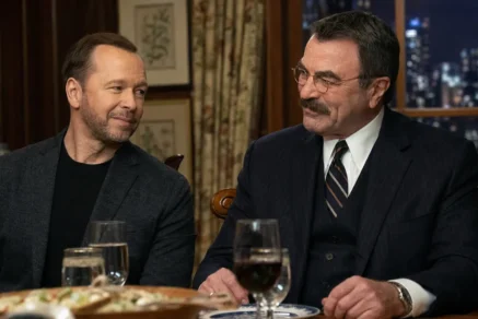 Donnie Wahlberg and Tom Selleck seated together at a family dinner table