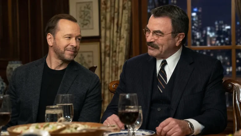 Donnie Wahlberg and Tom Selleck seated together at a family dinner table