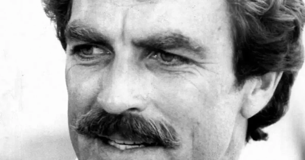 Tom Selleck in a 1980 publicity portrait, mustache and thoughtful expression from the Magnum era