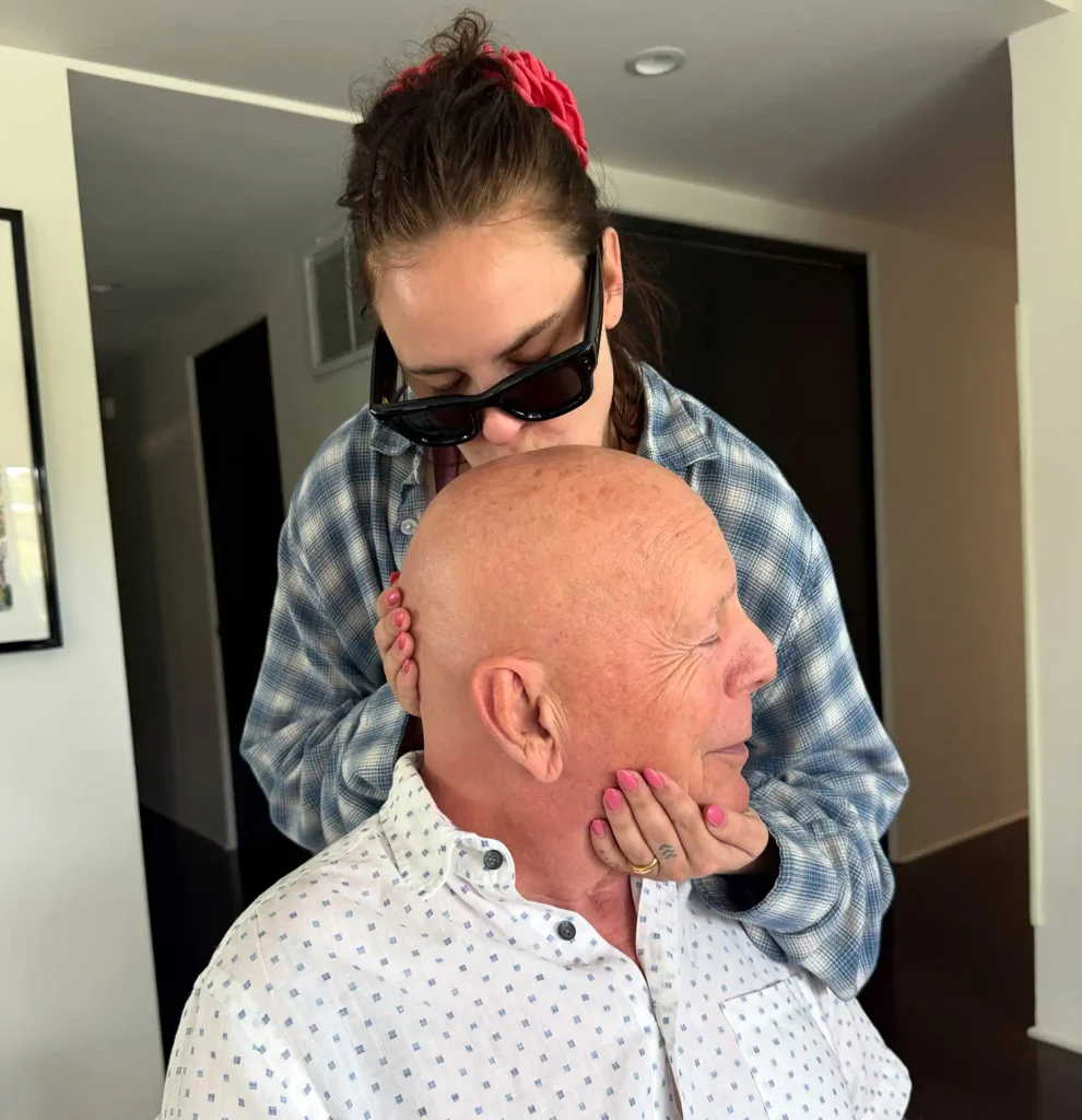Tallulah Willis kisses dad Bruce in recent snap.